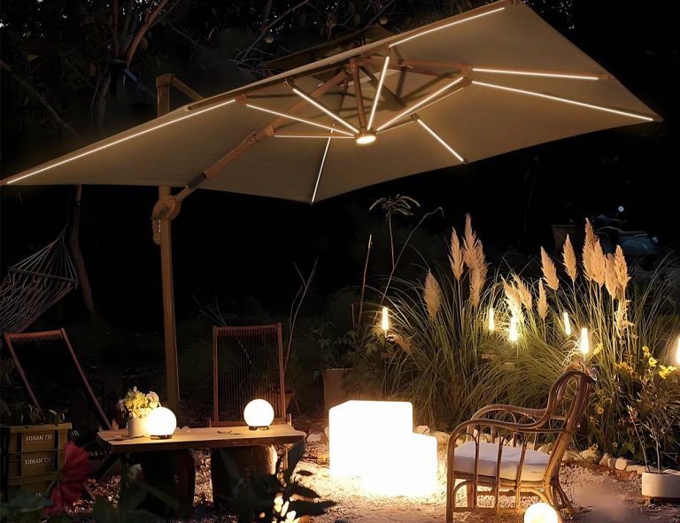 Rectangle LED patio umbrella over a dining set at night